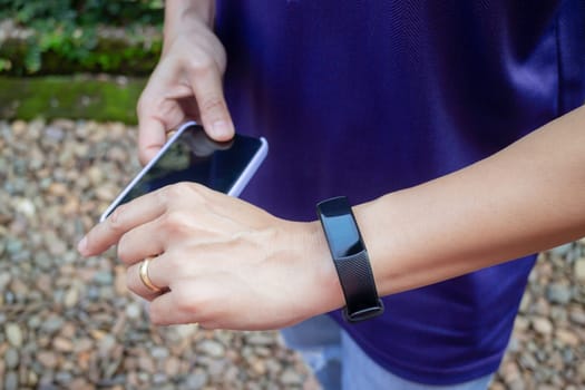 Healthy lifestyle concept female wearing sport tracker wristband arm, stock photo
