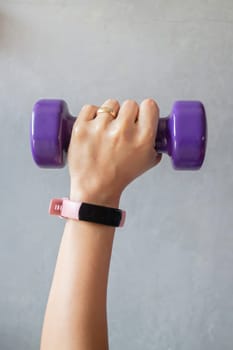 Healthy lifestyle concept female wearing sport tracker wristband arm, stock photo