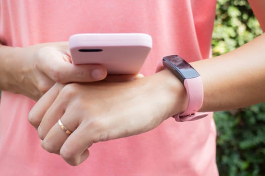 Healthy lifestyle concept female wearing sport tracker wristband arm, stock photo