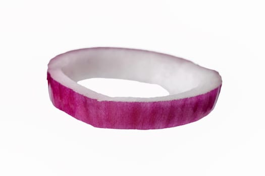 Red onion flying ring isolated on a white background, with selective focus