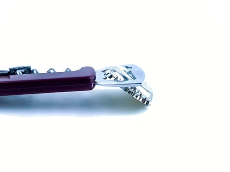 Beer bottle cap and bottle opener on a white background. Place for text.