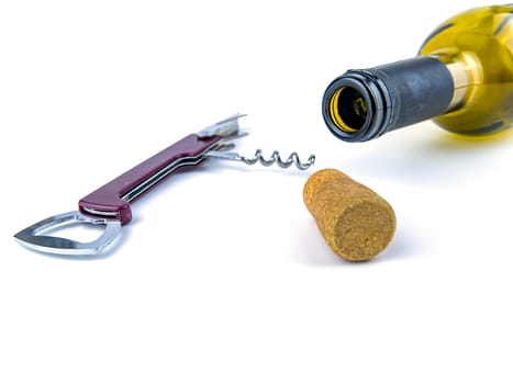 Cork from a wine bottle and a corkscrew on a white background. Place for text.