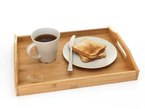 A close up shot of a wooden breakfast tray