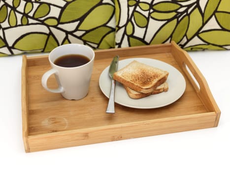 A close up shot of a wooden breakfast tray