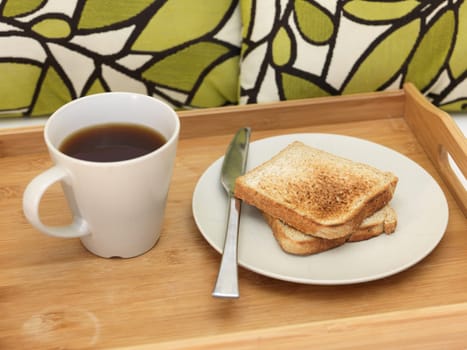 A close up shot of a wooden breakfast tray