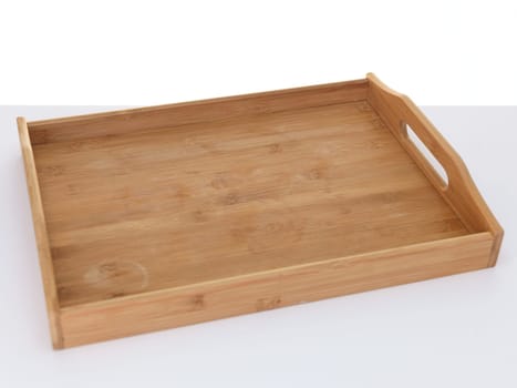 A close up shot of a wooden breakfast tray