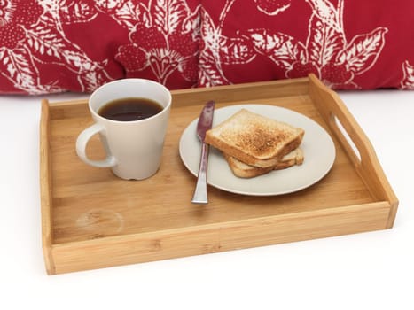 A close up shot of a wooden breakfast tray
