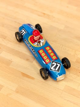 A close up shot of a toy metal car