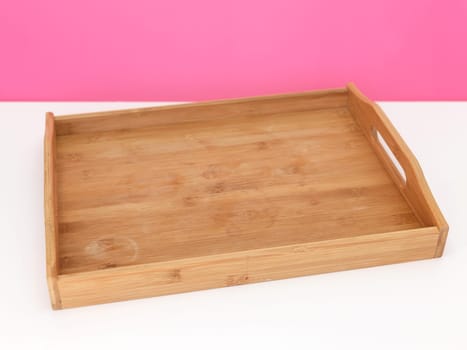 A close up shot of a wooden breakfast tray