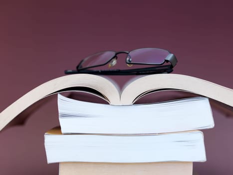 A close up shot of a pile of books
