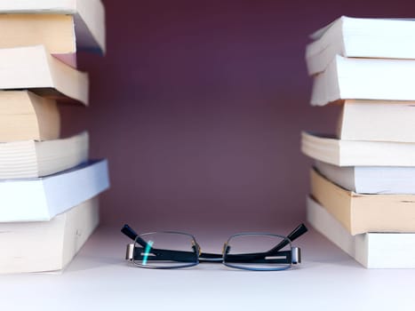 A close up shot of a pile of books