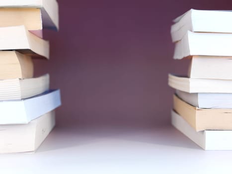 A close up shot of a pile of books