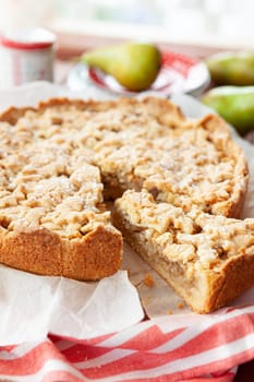 Fresh apple / pear pie with powdered sugar and fresh pears