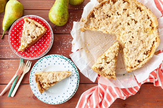 Fresh apple / pear pie with powdered sugar and fresh pears