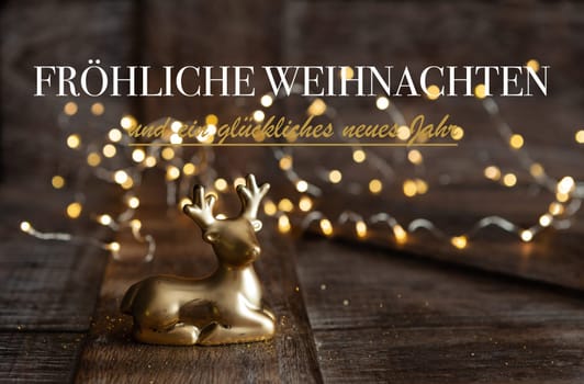 Little golden deer in front of Christmas lights