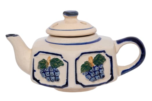 Teapot isolated. Close-up of a vintage colorful blue white tea pot made of ceramic pottery isolated on a white background. Macro photograph.