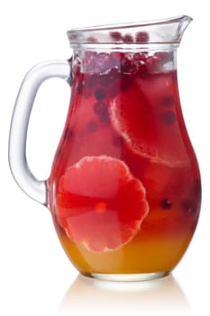 Cranberry grapefruit iced drink in a glass pitcher, isolated