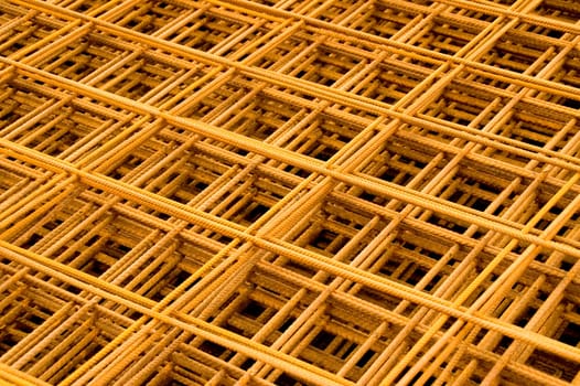 A stack of russet reinforcement steel mats. With space for copy.