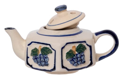 Teapot isolated. Close-up of a vintage colorful blue white tea pot made of ceramic pottery isolated on a white background. Macro photograph.