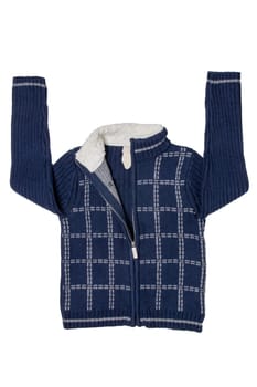 Autumn and winter children clothes. A cozy warm dark blue cardigan or jacket with a white checkered pattern for the little boy isolated on a white background. Kids spring fashion.