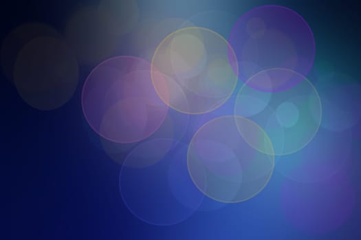 Abstract dark blue gradient pink pastel background texture with glitter defocused sparkle bokeh circles and glowing circular lights. Beautiful backdrop with bokeh light effect.