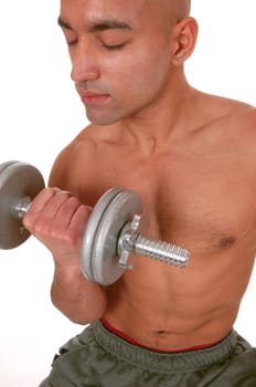 A handsome shirtless young man working out with a dumbbell with his.eyes closed, wearing his truck pants, isolated for white background.