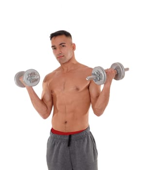 A east Indian man working out wit two dumbbells shirtless in his.track pants and red underwear, isolated for white background.
