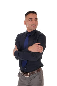 A handsome east Indian business man standing in the studio isolated.over white background, in a black shirt with his arms crossed.
