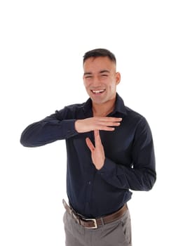 A happy young man standing in the studio isolated for white .background signing he likes to talk.