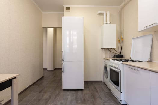 Interior of a small kitchen with a gas boiler