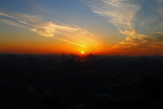 The orange sunset over the city of Seoul