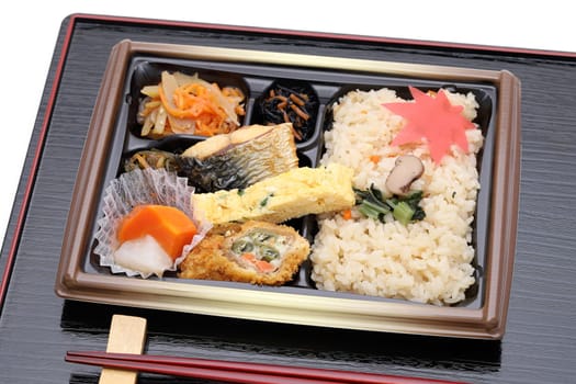 Japanese bento lunch with chopsticks on tray