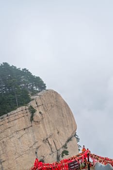 Huashan, China -  August 2019 : View of the stunning mountain landscape from the West Peak on Huashan mountain, Xian, Shaanxi Province