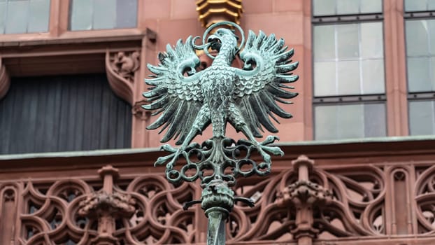 FRANKFURT AM MAIN, GERMANY, October 5 th 2019: Coat of arms incorporated in front of facade of public building in Frankfurt am Main, Germany.