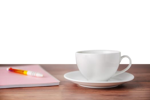 A cup of coffee with notebook on wooden isolated on white background