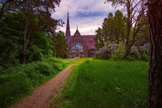 Old finnish church Koiviston kirkko in Primorsk city of Russia at sunset. Travel in europe.