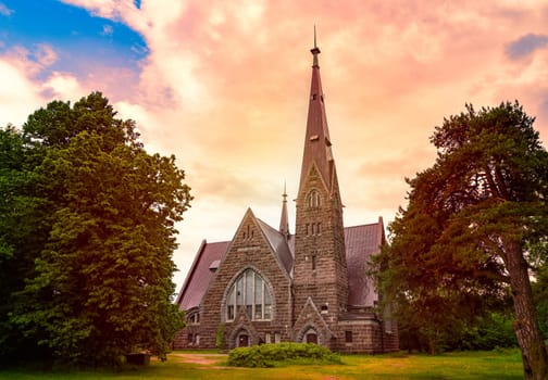 Old finnish church Koiviston kirkko in Primorsk city of Russia at sunset. Travel in europe.