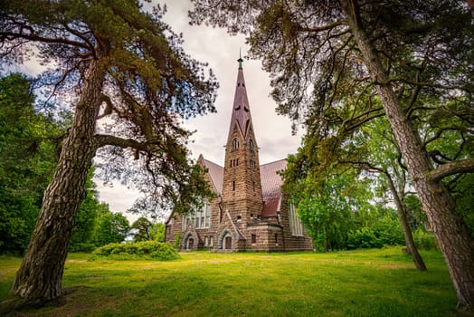 Old finnish church Koiviston kirkko in Primorsk city of Russia at sunset. Travel in europe.