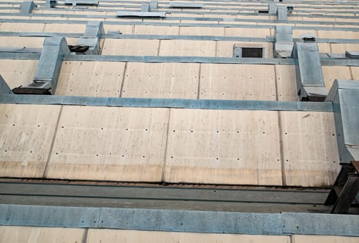 Roof of an industrial building with air ventilation pipes. Background image. Place for text.