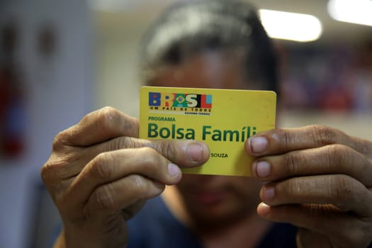 SALVADOR, BAHIA / BRAZIL - August 11, 2017: Family Allowance Card is seen as a user of the social benefit provided by the Federal Government of Brazil. (Joa Souza / Panthermedia).