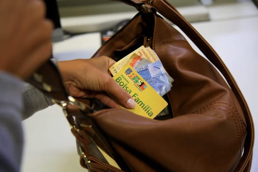 SALVADOR, BAHIA / BRAZIL - August 11, 2017: Family Allowance Card is seen as a user of the social benefit provided by the Federal Government of Brazil. (Joa Souza / Panthermedia).
