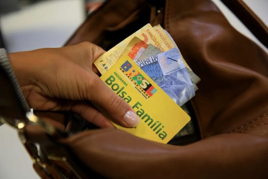 SALVADOR, BAHIA / BRAZIL - August 11, 2017: Family Allowance Card is seen as a user of the social benefit provided by the Federal Government of Brazil. (Joa Souza / Panthermedia).