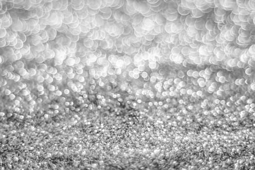 Glitter light abstract silver bokeh christmas light blurred background
