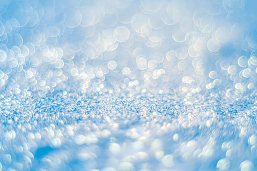 Glitter light abstract blue bokeh christmas light blurred background