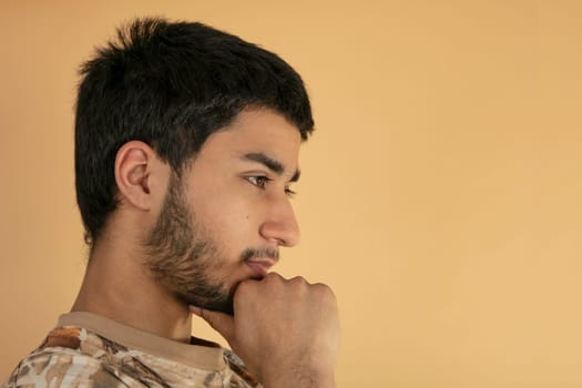 Friendly young Man on beige Background