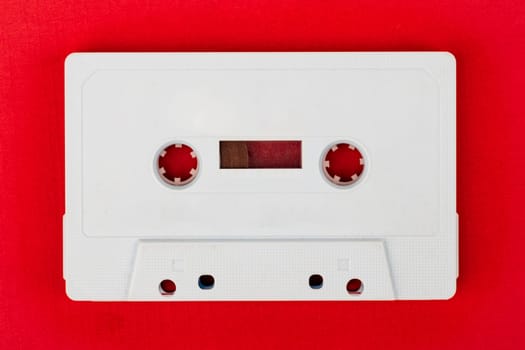 Retro Audio Tape isolated on red background