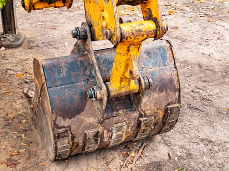 Iron bucket of a construction excavator. Technics.