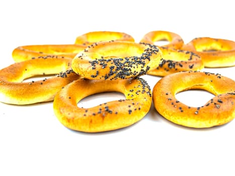 Bagels with poppy seeds on a white background. Drying. Food photo.