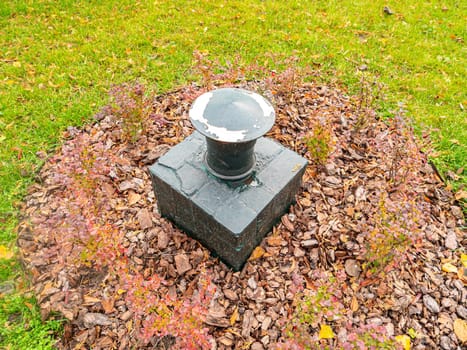 Ventilation pipe on the green grass. Industry.
