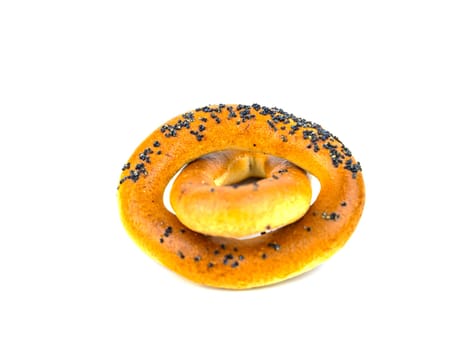 Bagels with poppy seeds on a white background. Drying. Food photo.